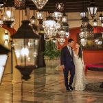 bride and groom walking through lantern room in cancun mexico